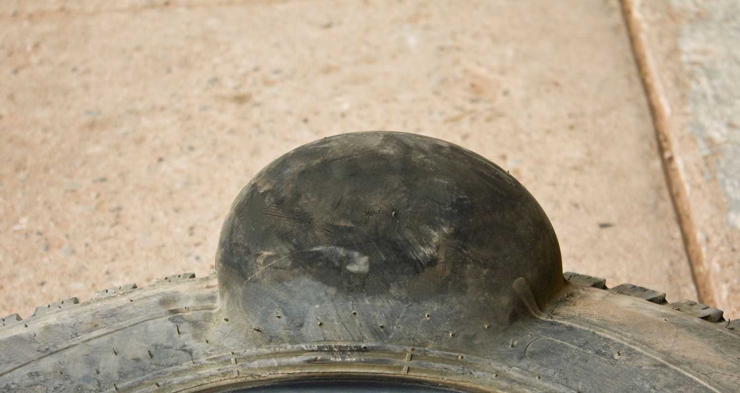 Huhe tyre bulge after hitting a pothole in Barbados
